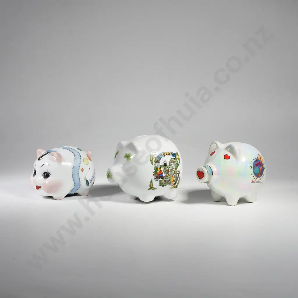 Three White Ground Piggy Banks decorated including a Painted Face Pig w Bow, a Shamrock Decorated Pig & one w Hearts Image 1++
