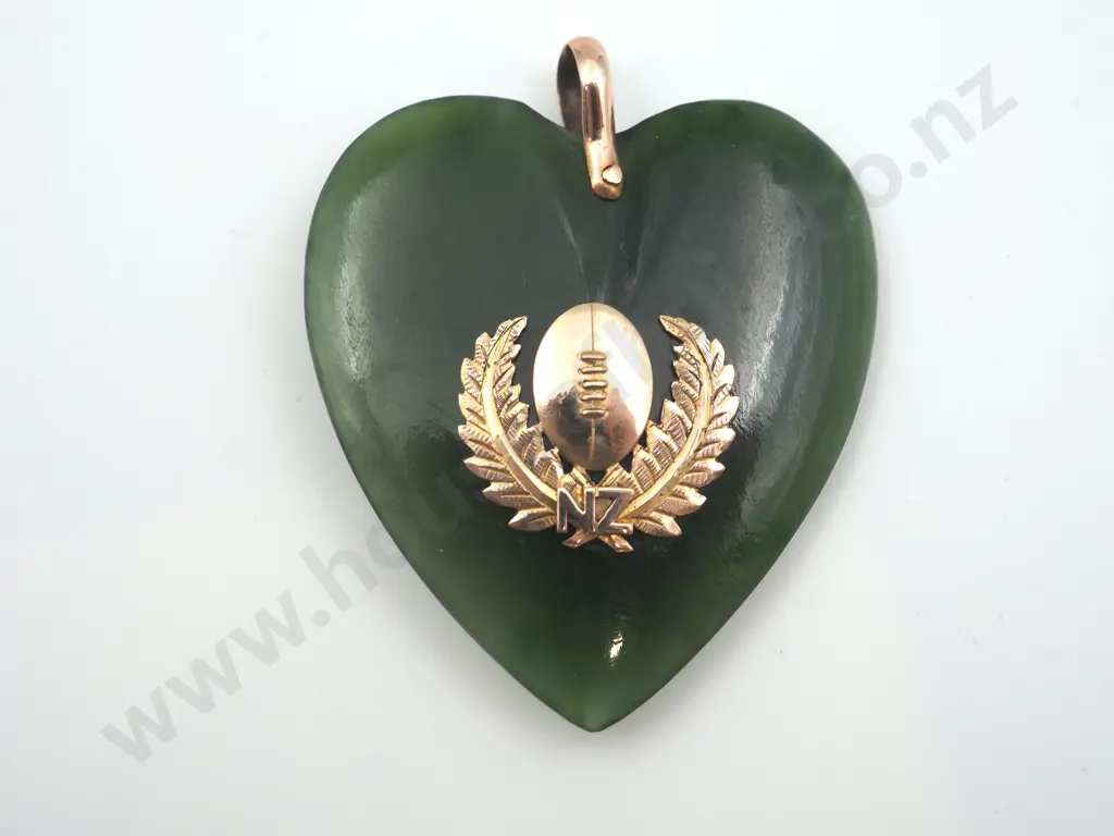 Of New Zealand Rugby Interest: A Large Greenstone Heart Pendant with Rugby Ball Flanked by Fern Leaves Image 1++