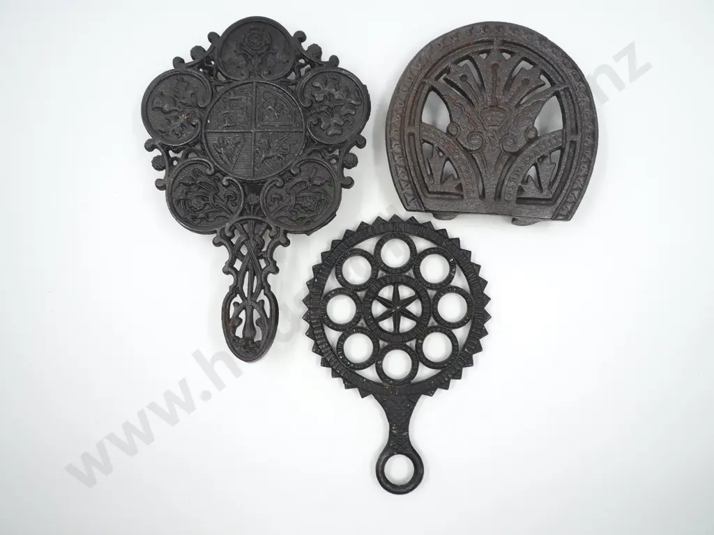 Trio of Antique Cast Iron Trivets Image 1++