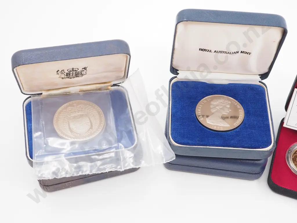 7 New Zealand Commemorative Cased Coins incl $5 and $10 coins Image 1++