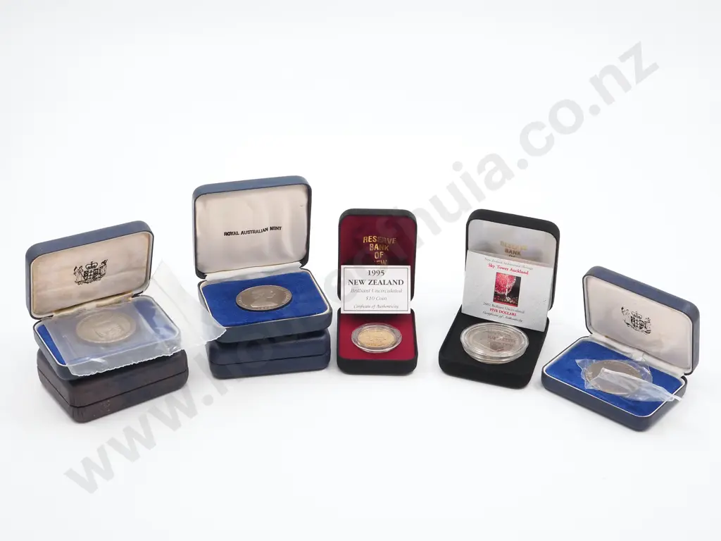 7 New Zealand Commemorative Cased Coins incl $5 and $10 coins Image 1++