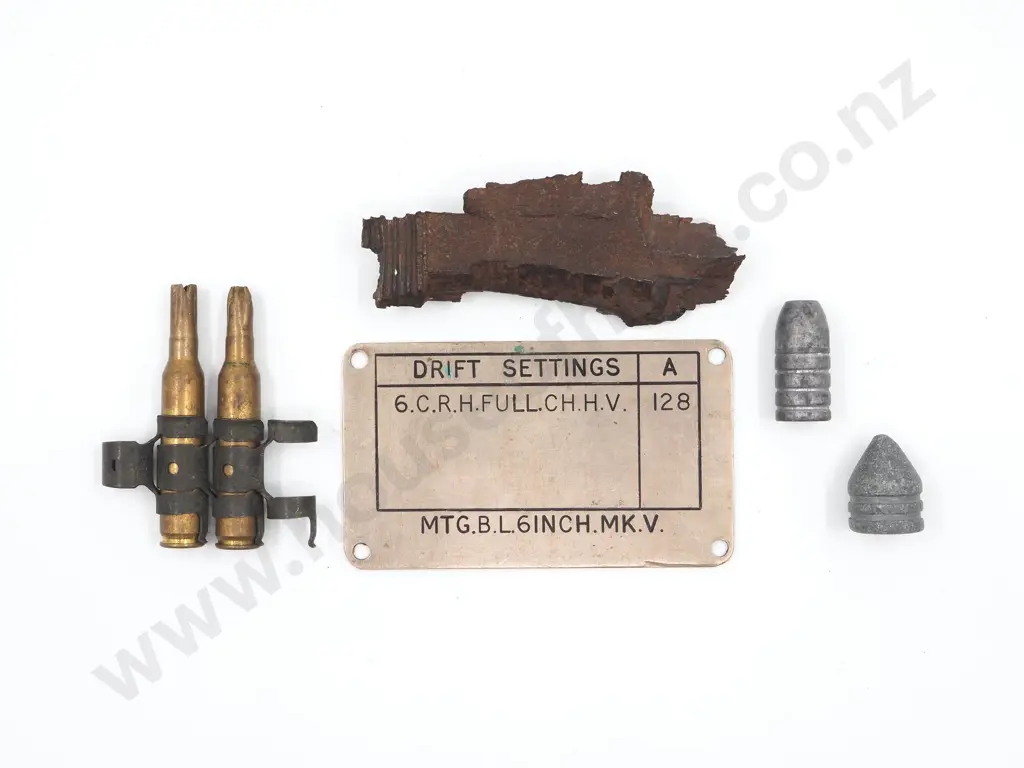 Selection of Ordinance Related Items: Shrapnel from Artilery Shell, Lead Bullets, Blanks, Gun Tag from 6 Inch Mk 5 Image 1++