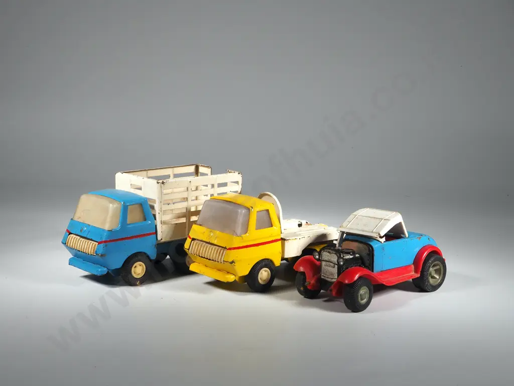 Three Small Tonka Trucks Image 1++