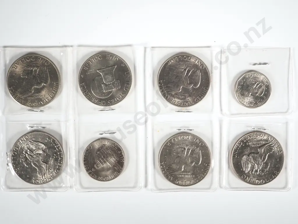 Five Eisenhower Dollars; One US Dollar Coin; One 1976 Half Dollar Image 1++