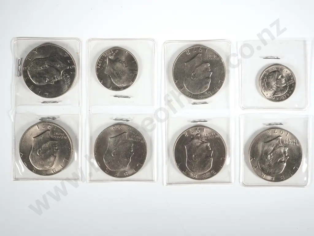 Five Eisenhower Dollars; One US Dollar Coin; One 1976 Half Dollar Image 1++