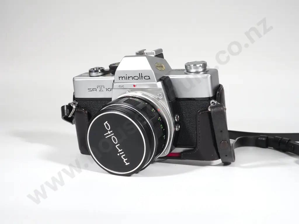 Bag Containing Vintage Minolta Camera and Lenses Image 1++