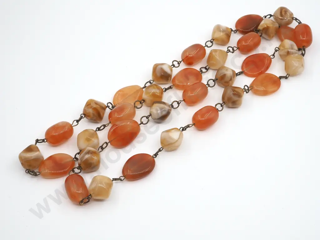 Bag Containing Orange Coloured Beads Image 1++