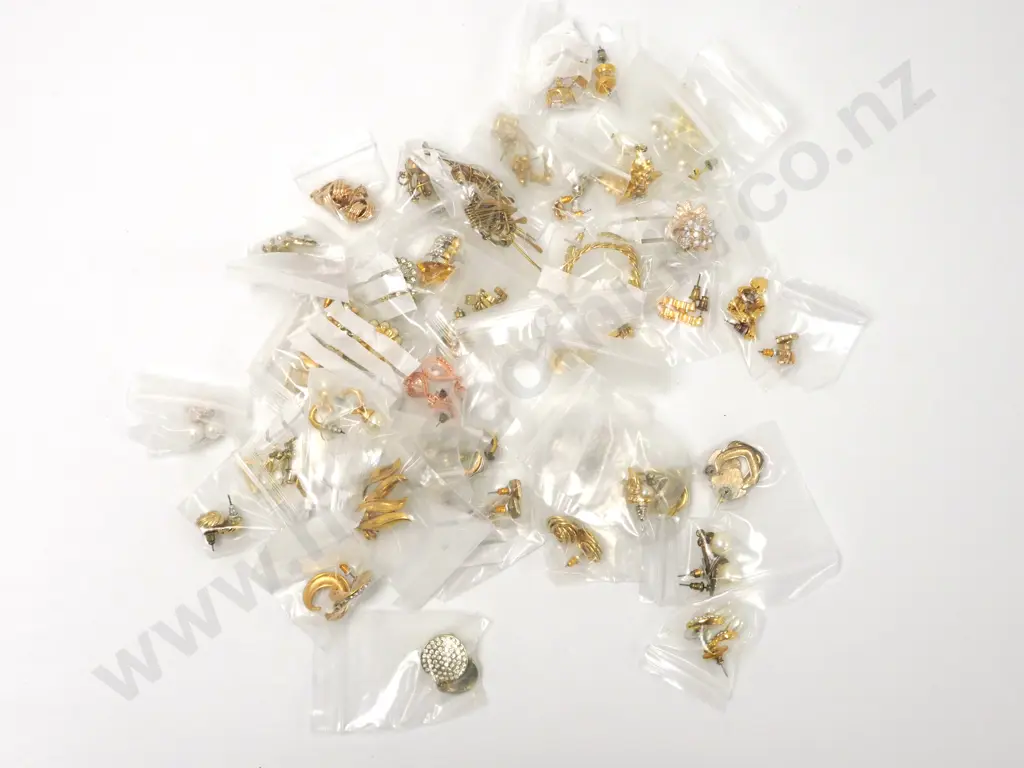 Bag Containing Gold Coloured Earrings Image 1++