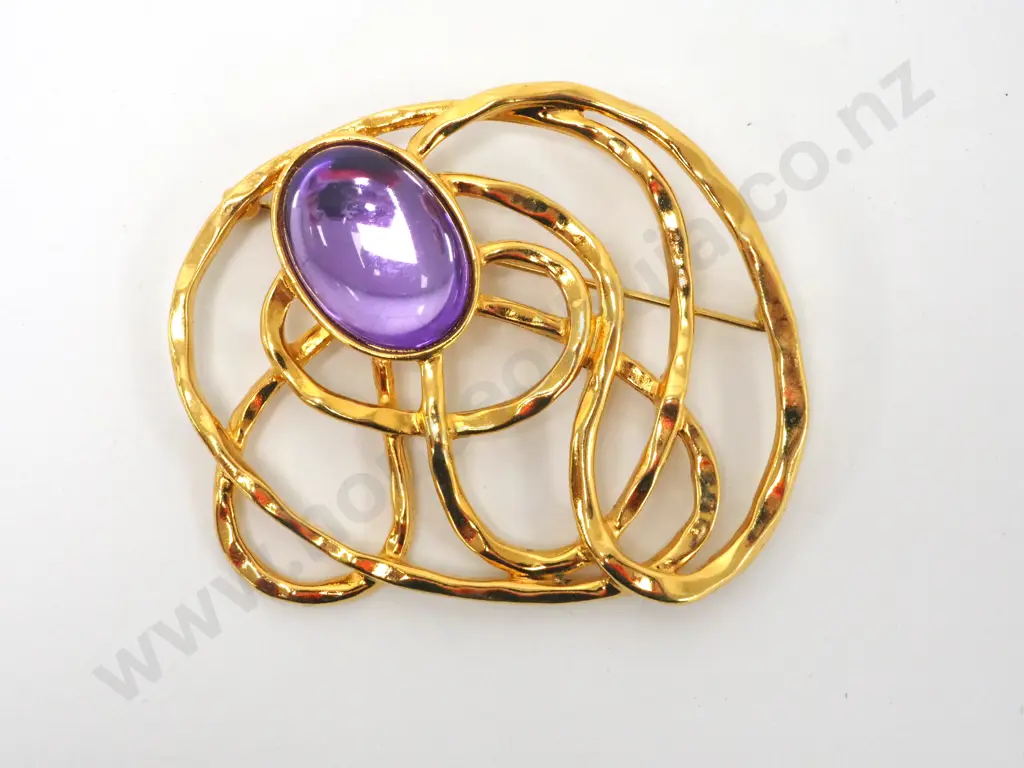 Bag Containing Large Brooch with Purple Stone Image 1++