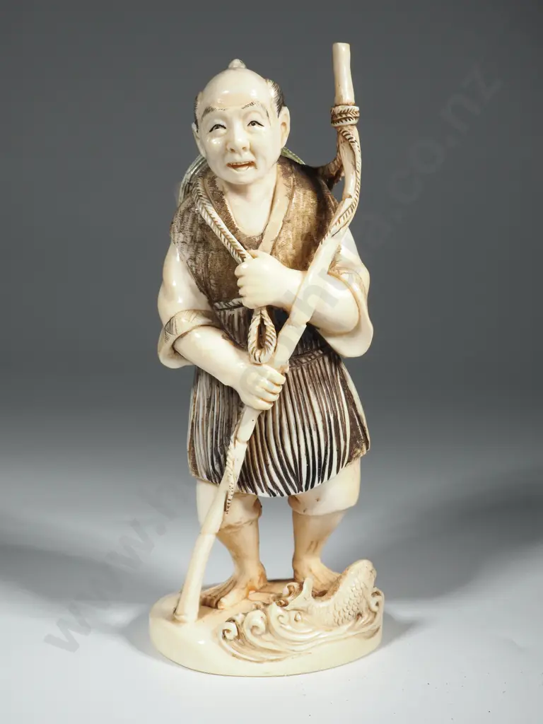 Ivory Okimono Depicting A Fisherman With A Staff & A Fish At His Feet Image 1++