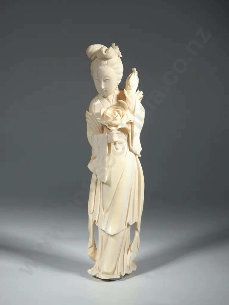 Ivory figure Of A Female, Possibly Guan Yin, A Bodhisattva Revered In Buddhism, Holding A Lotus Flower Image 1++