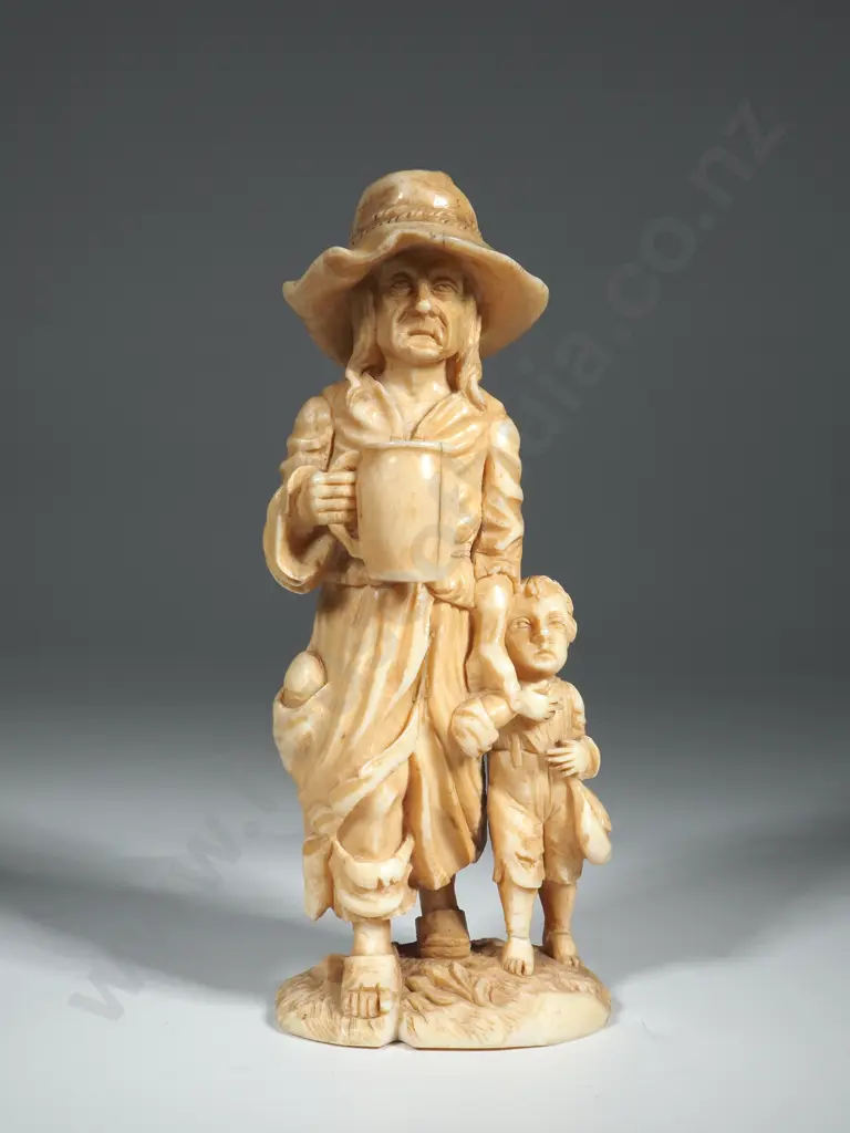 An Ivory Figure Depicting A Peasant Woman & A Young Child. The Woman Holds A Large Mug Image 1++