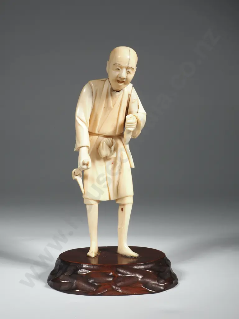 Antique Chinese Okimono  of a Fisherman On A Wooden Stand With Fish in One Hand & Filleting Tool in The Other Image 1++