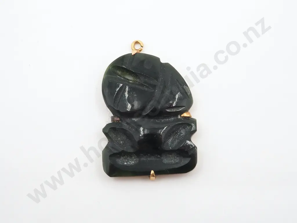 Stylized Greenstone Tiki On A Gold Backing. Image 1++