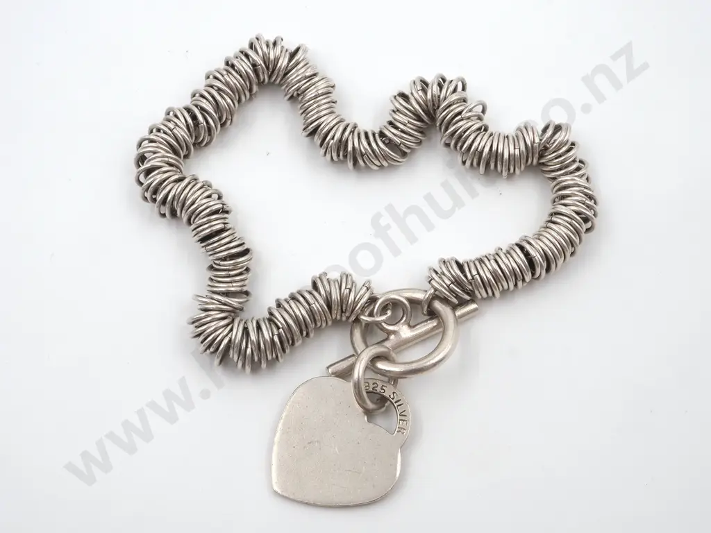Unusual Silver Bracelet Comprising Jump Rings On a Fine Chain With Heart Shaped Locket Image 1++