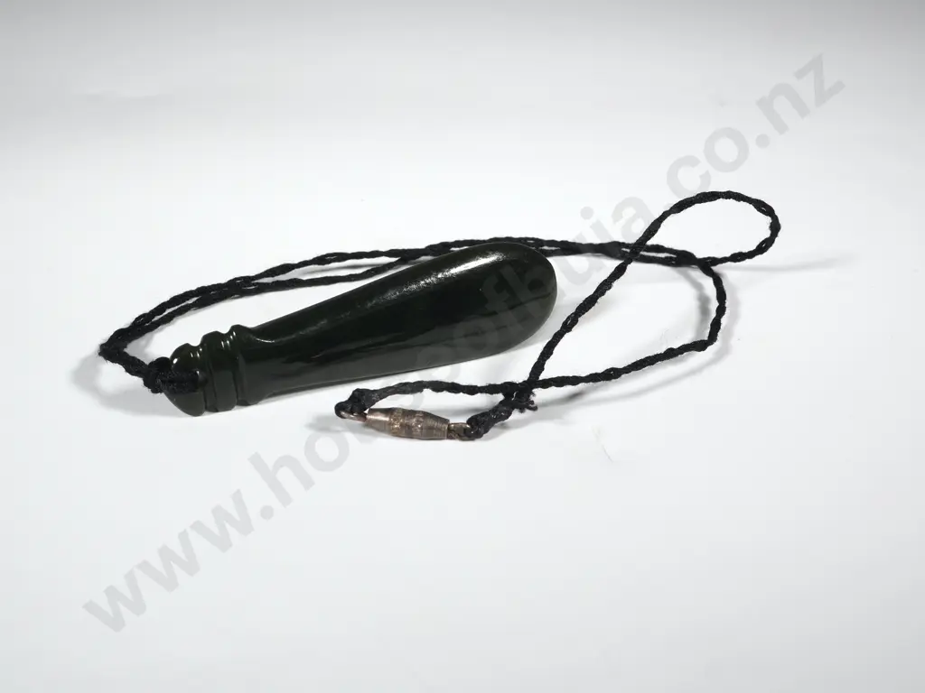 Greenstone Pendant In The Form Of A Patu Image 1++