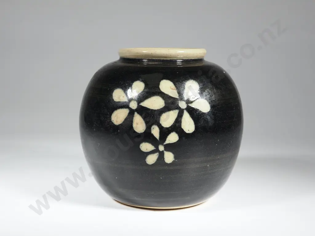 Bulbous Pottery Vase w Black Ground &  Stylized Daisy Pattern. Marked With An S In A Circle. Image 1++