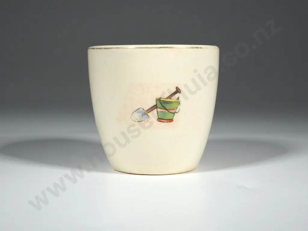 Crown Lynn Egg Cup. White Ground with Bucket & Spade, Ball & Skipping Rope, Yacht. Gold Lettering Crown Lynn Image 1++