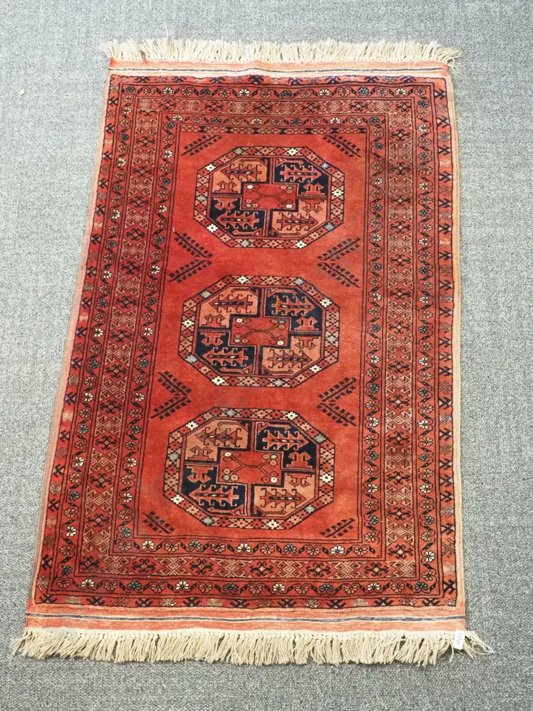 Fine Andkhoi Afganistan Rug Red Ground With Three Large Central Geometric Patterns Surround by Four Alternating Borders Image 1++