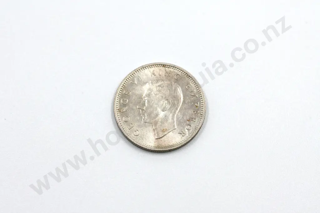 1940 sixpence, uncirculated with full mint lustre, light toning on obverse. C.V. $400 Image 1++
