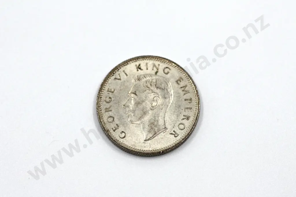 1941 shilling, almost uncirculated with mint lustre, some toning. C.V. $500 Image 1++