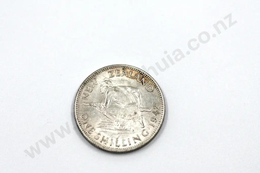 1942 shilling, almost uncirculated with mint lustre, some toning. C.V. $450 Image 1++