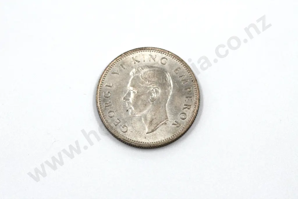 1945 shilling, brilliant uncirculated with full mint lustre, light toning. C.V. $225 Image 1++