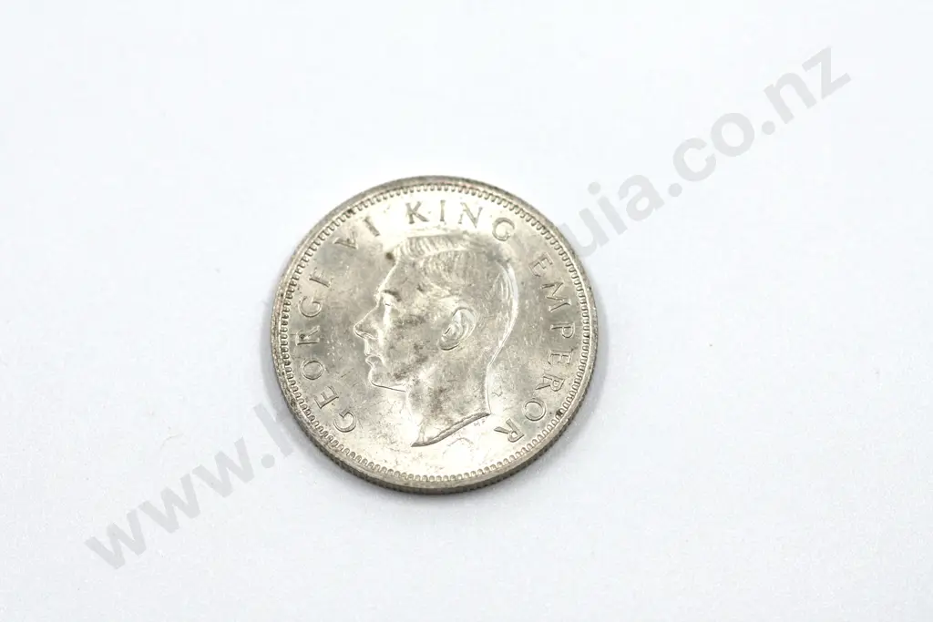 1946 shilling, brilliant uncirculated with full mint lustre, light toning. C.V. $225 Image 1++
