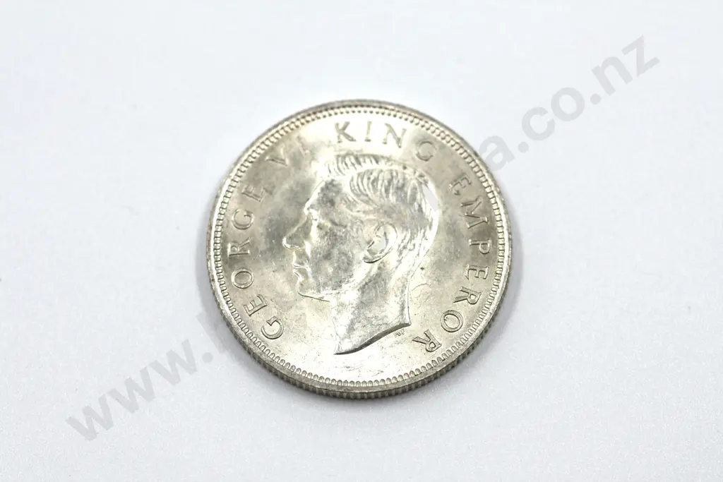 1942 florin, brilliant uncirculated with full mint lustre, lightly rubbed on the obverse. C.V. $650 Image 1++
