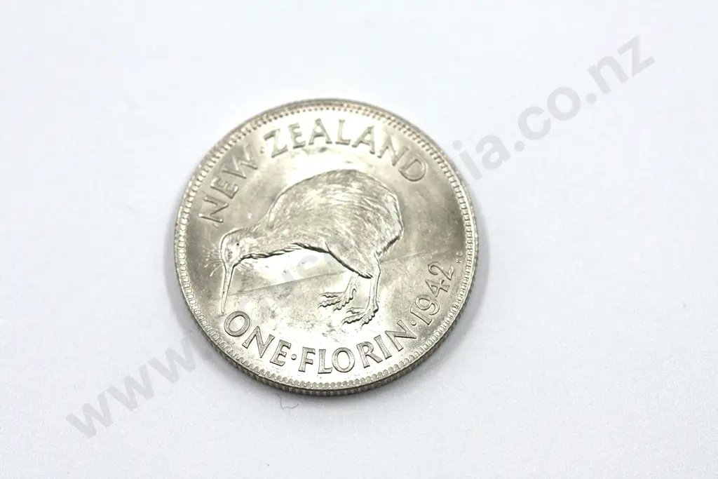 1942 florin, brilliant uncirculated with full mint lustre, lightly rubbed on the obverse. C.V. $650 Image 1++