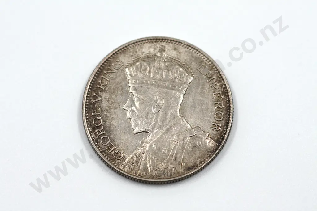 1935 halfcrown, uncirculated with mint lustre, some toning. C.V. $1500 Image 1++
