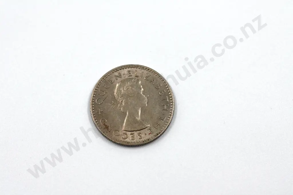 1957 ‘no shoulder strap’ sixpence, extremely fine. C.V. $250 Image 1++