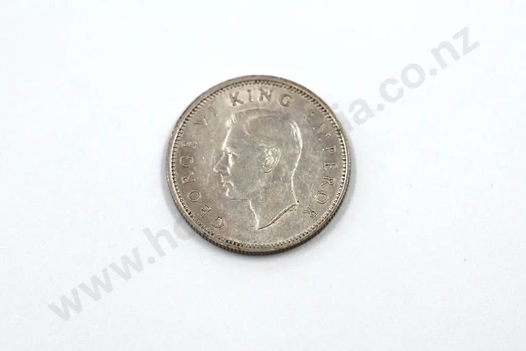 1942 ‘broken back’ shilling, very fine or better. C.V. $200 Image 1++