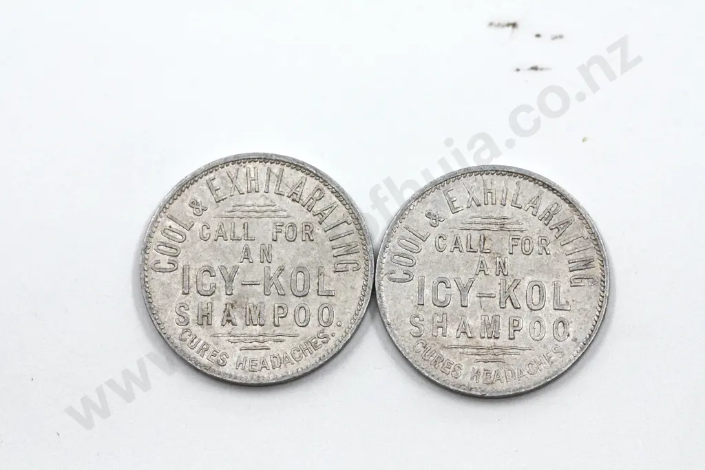 Icy-Kol 9 pence and 1 shilling and threepence Shampoo ( Barber’s ) aluminium tokens. Combined C.V. $100 Image 1++