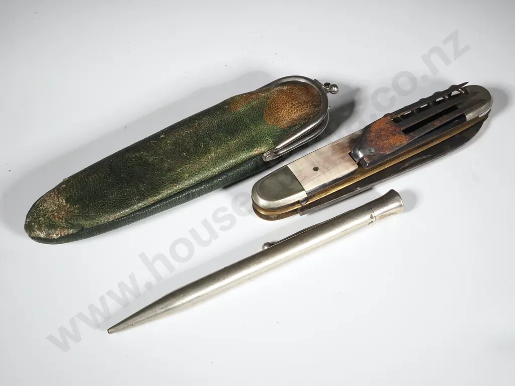 A Pocket Knife, A Silver Sheaffers Pencil, & a Slim Green Leather Purse. Image 1++