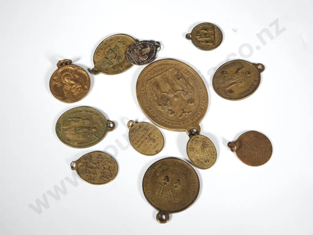 A Lot of Twelve Assorted Metal Religious Medals. Image 1++