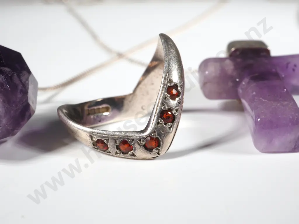 Amethyst Cross On Sterling Chain, Facetted Amethyst Pear Shaped Pendant On Chain & An Archer's Ring Set With Red Stones  Image 1++
