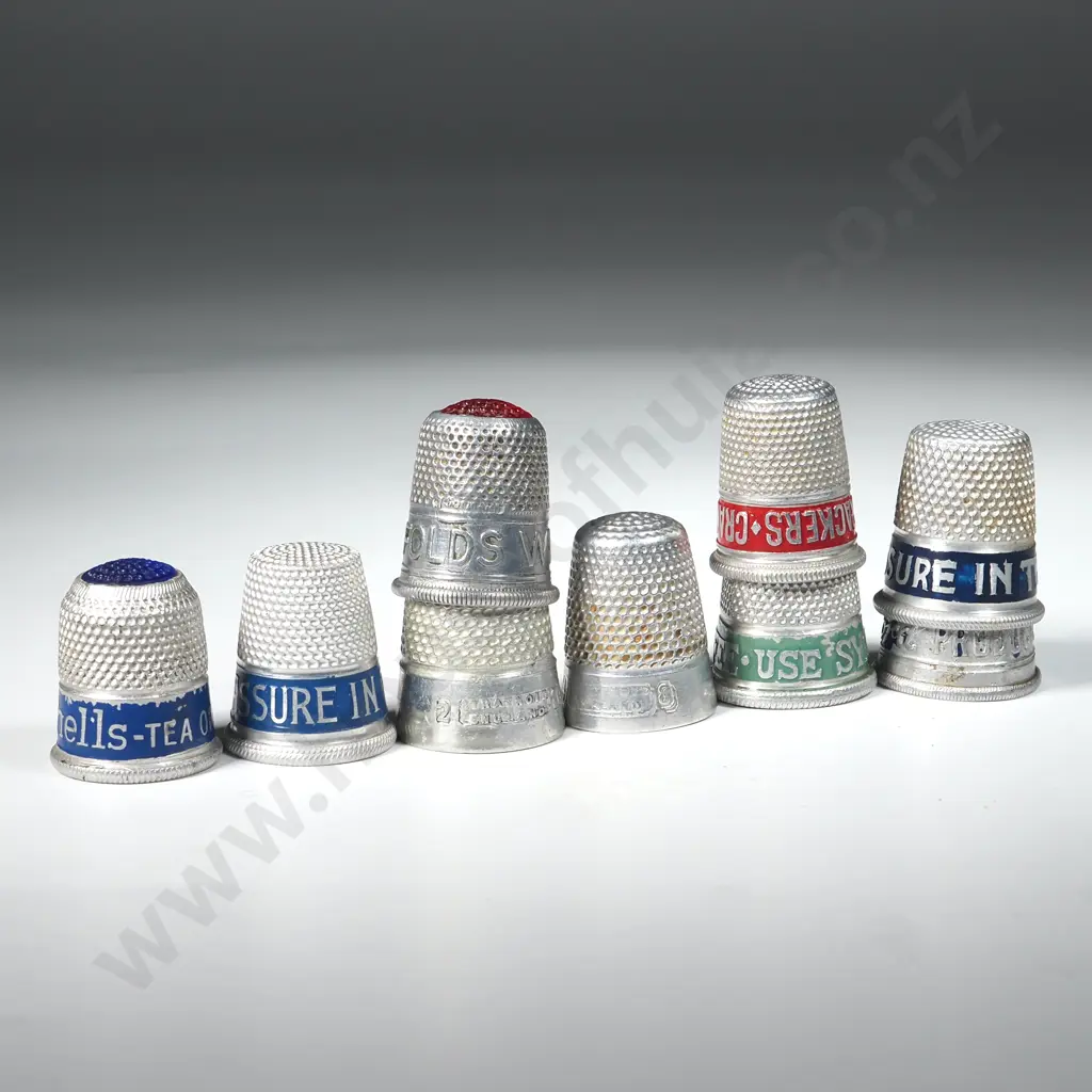 Nine White Metal Advertising Thimbles Image 1++