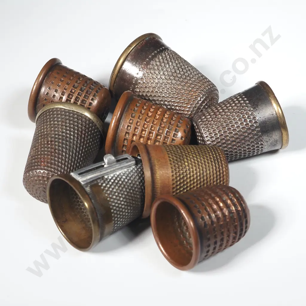 Eight Metal Thimbles. Two with Thread Cutters Image 1++