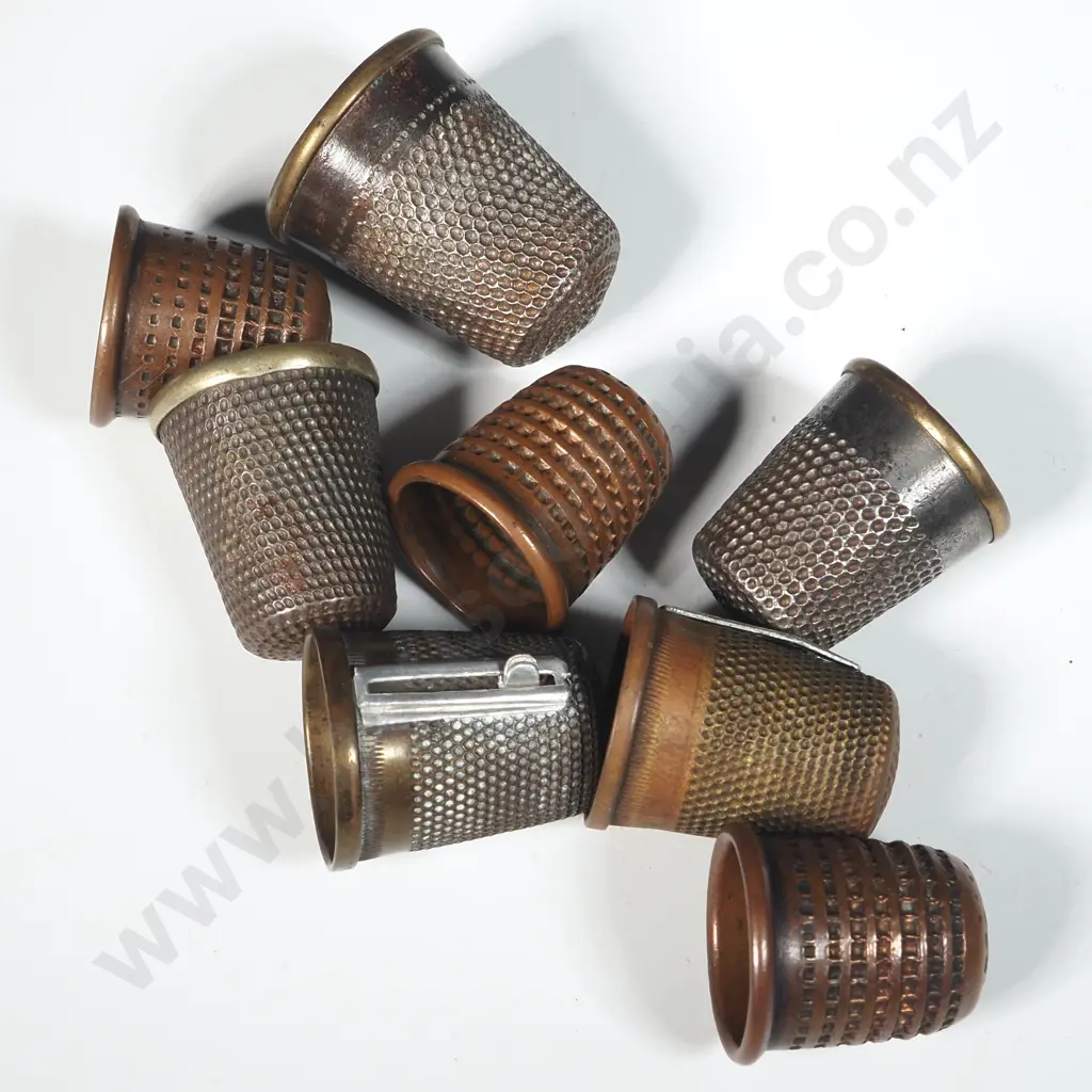 Eight Metal Thimbles. Two with Thread Cutters Image 1++