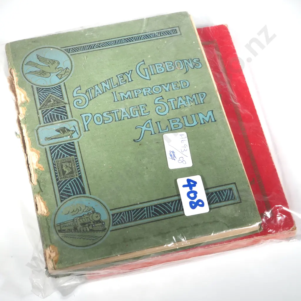 The New 'Wyndham' Stamp Album & Stanley Gibbons Improved Postage Stamp Album. Image 1++