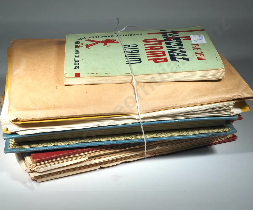 Four Stamp Albums w Stamps & an Envelope of Stamps on Pages. Image 1++