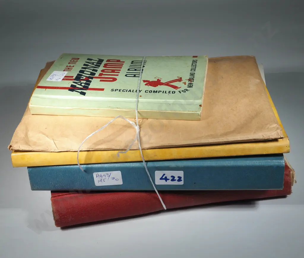 Four Stamp Albums w Stamps & an Envelope of Stamps on Pages. Image 1++