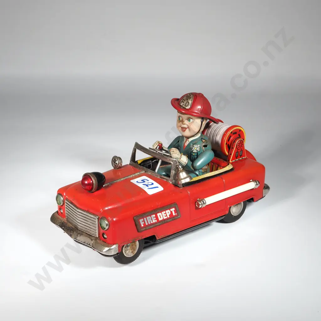 1950s Nomura Tin Red Fire Department Fire truck w Green Driver. Image 1++