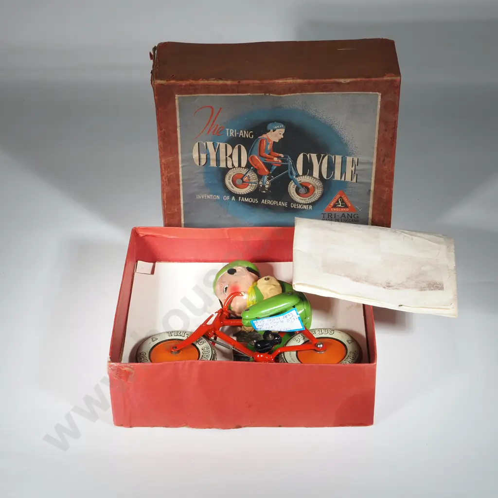 1930's Boxed Tri-Ang Green Gyro Cycle w Rider. Image 1++