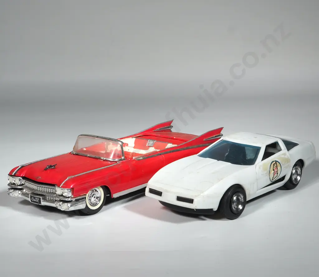 Two Plastic Model Vehicles: One red Convertible & One White Racing Car. Image 1++