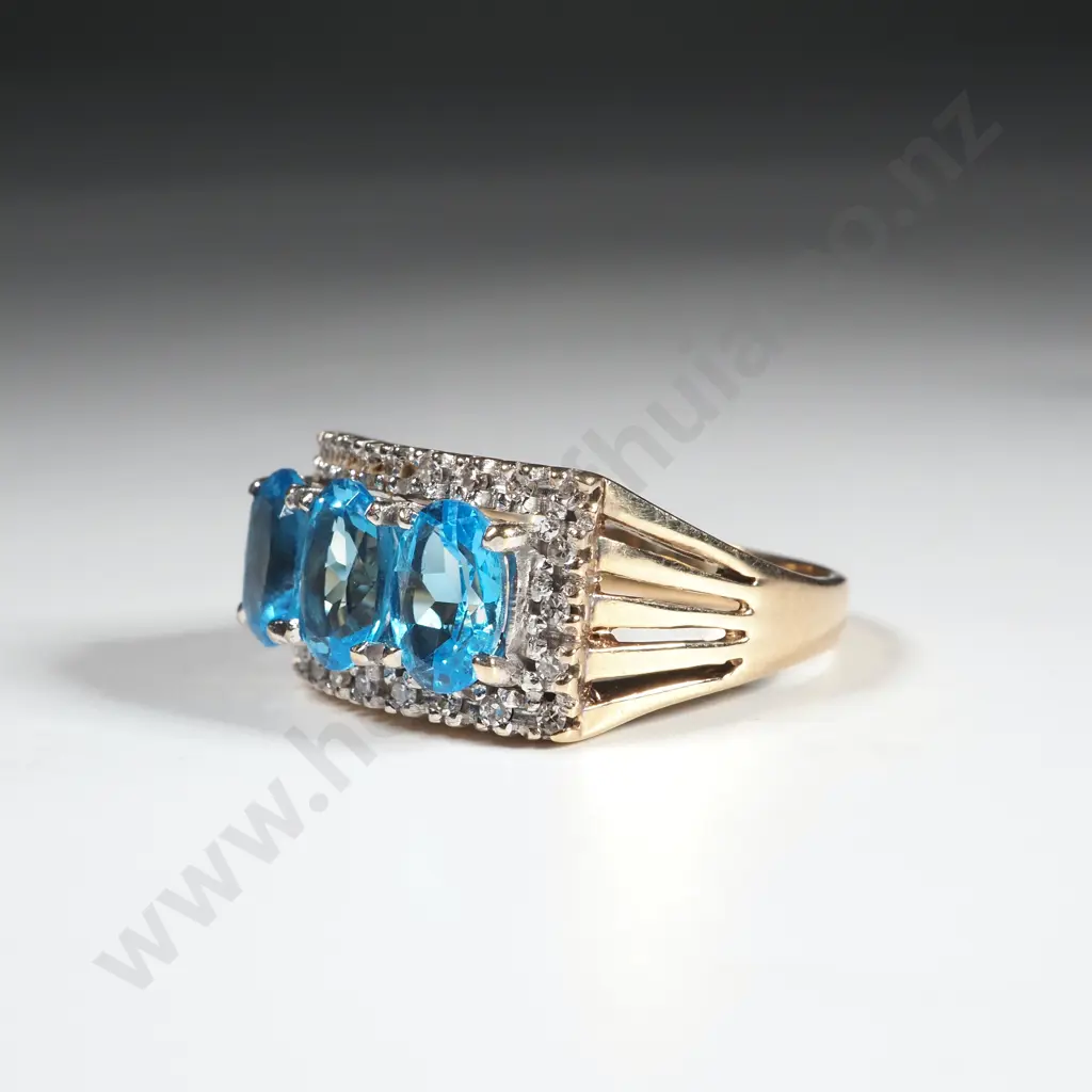 9ct Gold Blue Topaz  Bridge Set Ring Image 1++