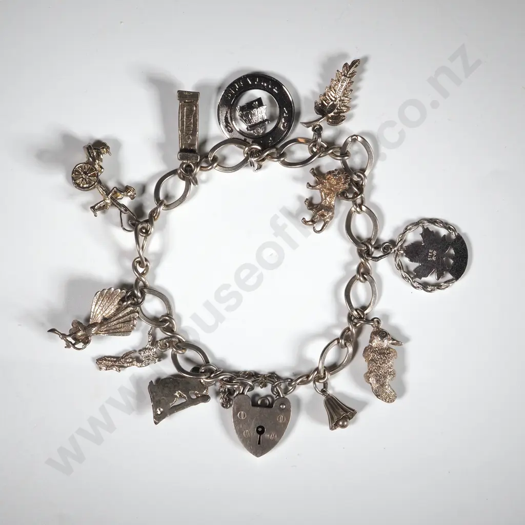 Sterling Silver Charm Bracelet With Eleven Various Charms  Image 1++