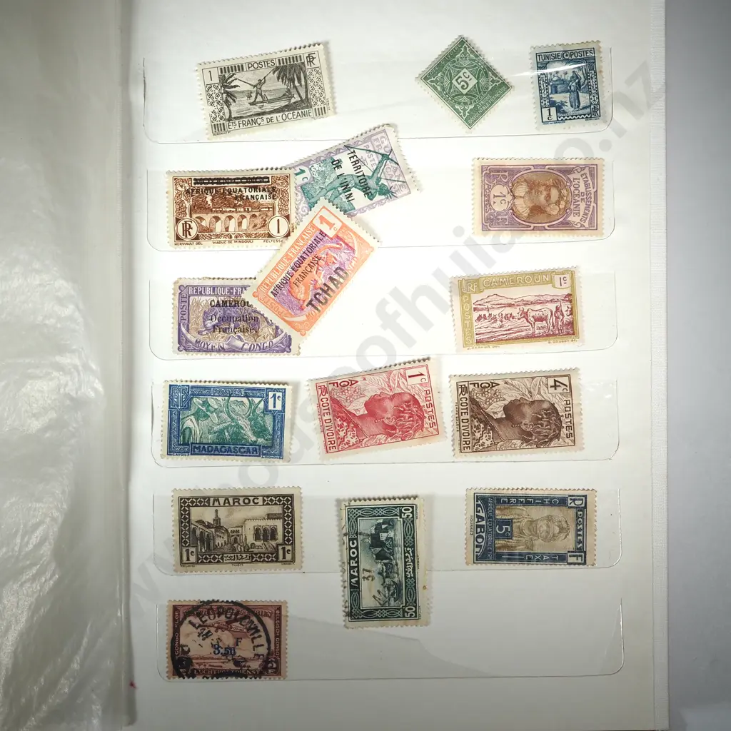 Stamp Album w Three Pages of Stamps Image 1++