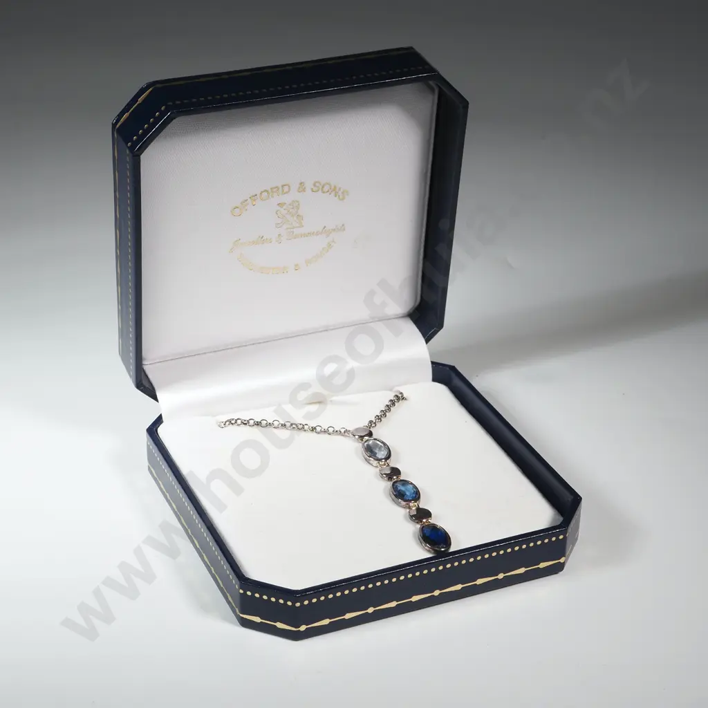 Sterling Silver Pendant Necklace.  Pendant - Alternating Dark Blue/Pale Blue Gems and Silver Circles. Image 1++